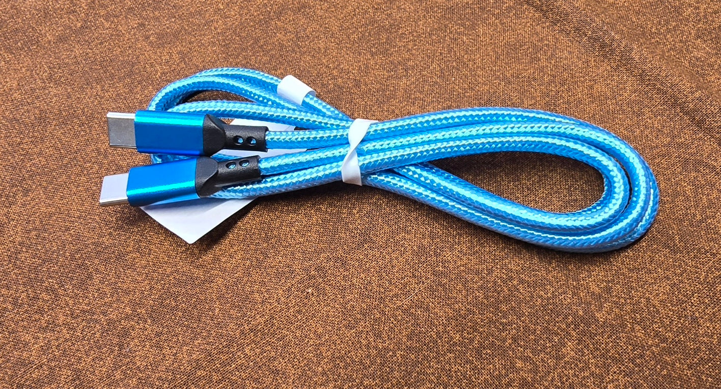 Blue braided cable with USB connectors on a brown surface