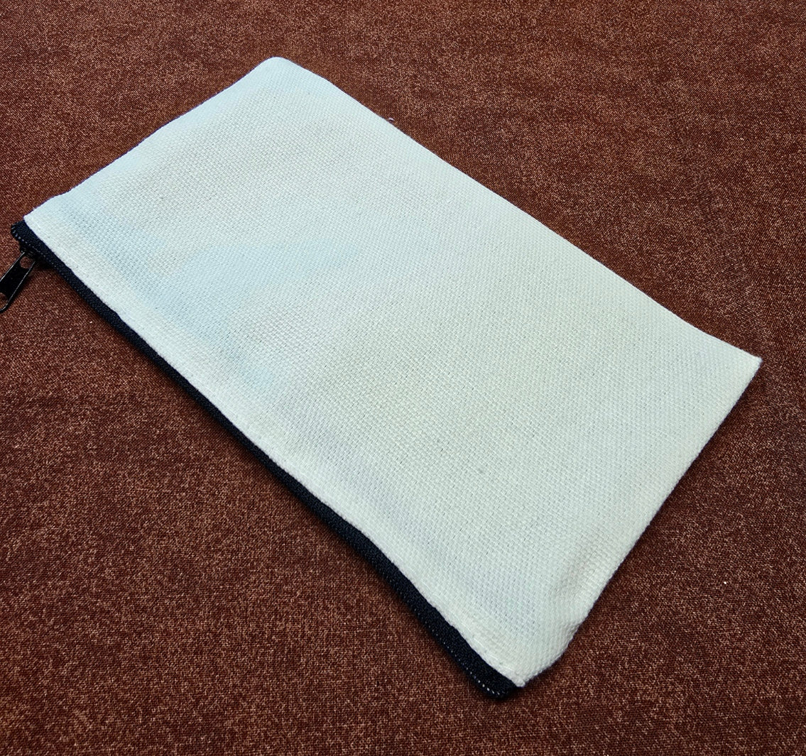 White zippered pouch on a brown textured surface